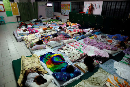 Female drug dependents watch tv as they take a rest inside a dormitory hall of Central Luzon Drug Rehabilitation Center in Pampanga province in northern Philippines, September 30, 2016. REUTERS/Erik De Castro