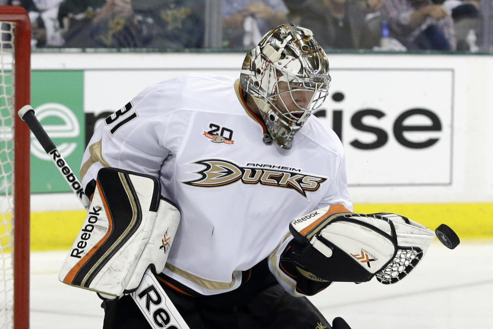 Anaheim Ducks' Frederik Andersen (31) of Denmark attempts to glove a shot by the Dallas Stars in the first period of Game 4 of a first-round NHL hockey Stanley Cup playoff series, Wednesday, April 23, 2014, in Dallas. (AP Photo/Tony Gutierrez)