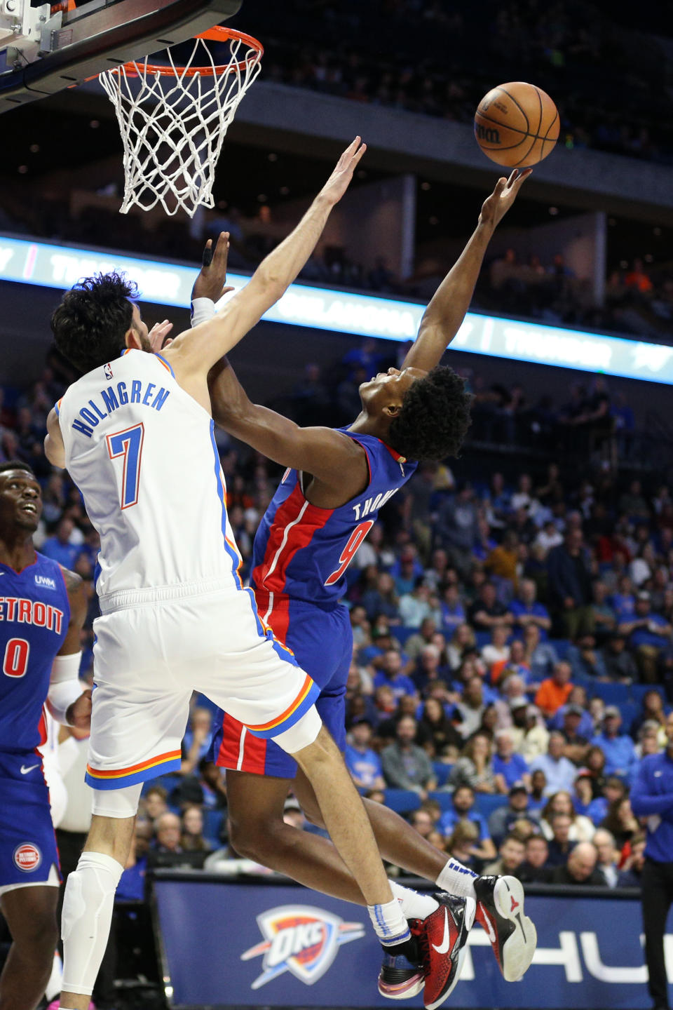 Oct 19, 2023; Tulsa, Oklahoma, USA; Detroit Pistons guard Zavier Simpson (9) shoots over Oklahoma City Thunder forward Chet Holmgren (7) in the first half at BOK Center. Mandatory Credit: Joey Johnson-USA TODAY Sports