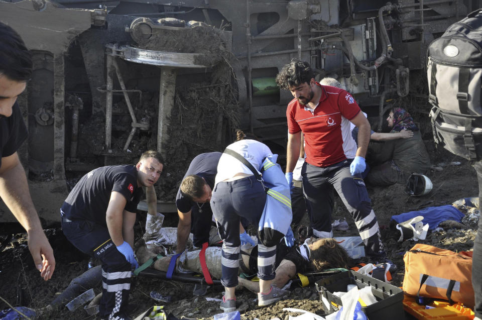 <p>Emergency services rescue victims from overturned train cars near a village in Tekirdag province, Turkey, July 8, 2018. (Photo: Mehmet Yirun/DHA-Depo Photos via AP) </p>