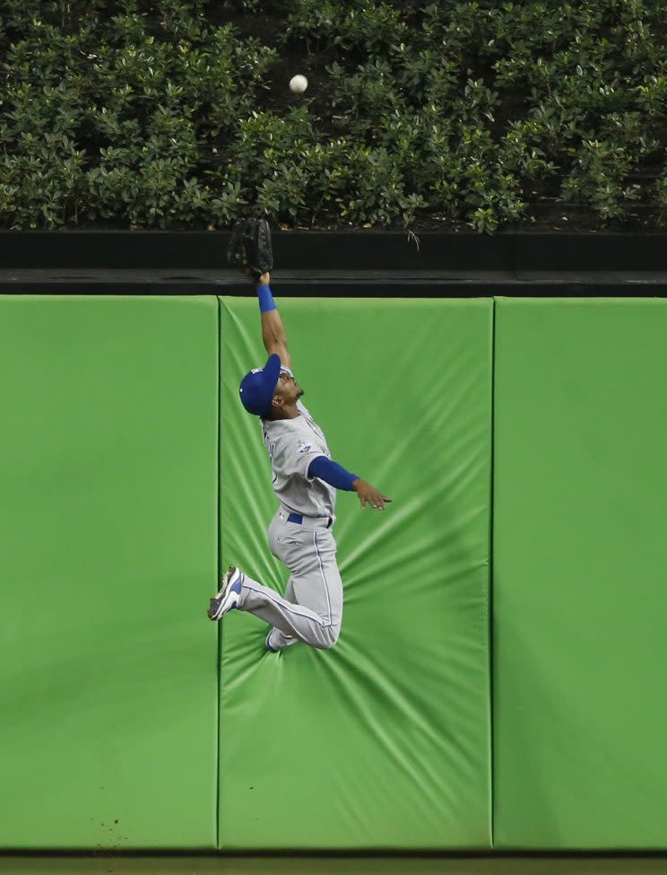 Jarrod Dyson robs the first home run in Marlins Park history. (AP Images/Wilfredo Lee)