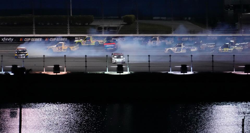 Trucks crash on the backstretch, bringing out the yellow flag early in the Fresh From Florida 250 on Friday, Feb. 17 at Daytona International Speedway.