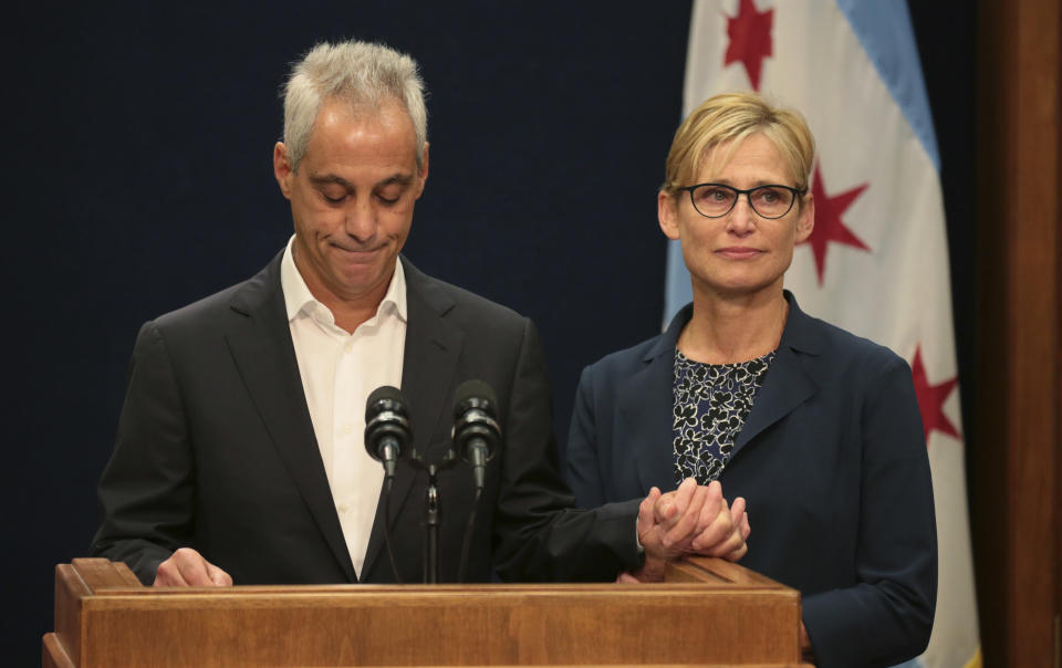 With wife Amy Rule by his side, Chicago Mayor Rahm Emanuel announces Tuesday, Sept. 4, 2018, he will not seek a third term in office at a press conference on the 5th floor at City Hall in Chicago. (Stacey Wescott/Chicago Tribune via AP)