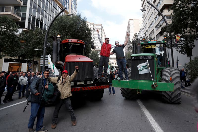Tractors block a street during a protest of Spanish farmers and ranchers against low tariffs and distribution costs in the agriculture sector in Murcia