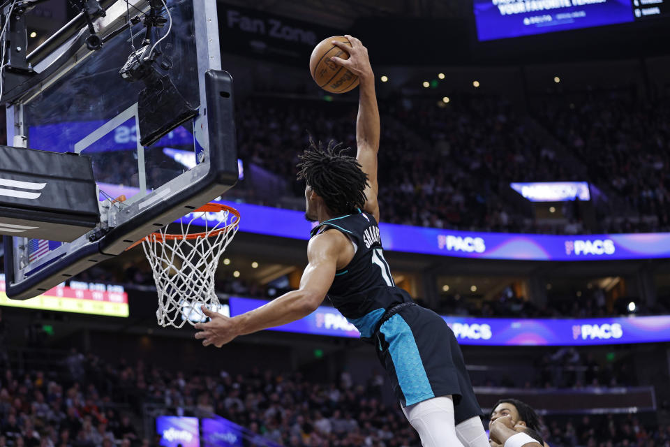 Portland Trail Blazers guard Shaedon Sharpe (17) dunks against the Utah Jazz in the first half during an NBA basketball game, Wednesday, March 22, 2023, in Salt Lake City. (AP Photo/Jeff Swinger)
