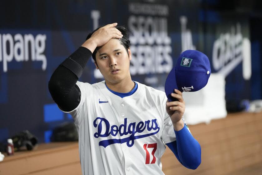 Los Angeles Dodgers' designated hitter Shohei Ohtani prepares for an exhibition game between Team Korea and the Los Angeles Dodgers at the Gocheok Sky Dome in Seoul, South Korea, Monday, March 18, 2024. (AP Photo/Lee Jin-man)