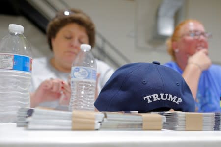 A hat embroidered with U.S. President Donald Trump's surname sits on a table at a leadership training session for local Republican Party officials and volunteers in Waukesha