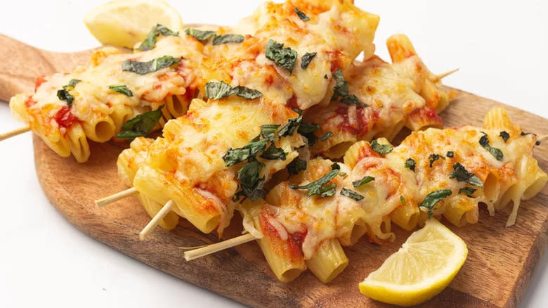 Pasta skewers on cutting board