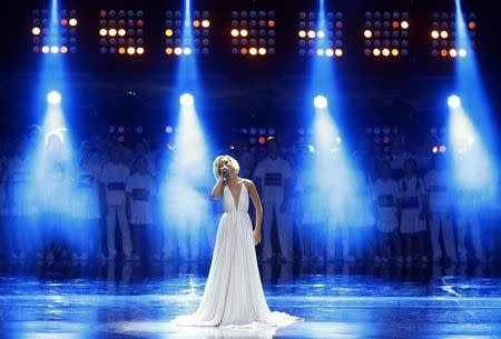 Artist Polina Gagarina performs during the preliminary draw for the 2018 FIFA World Cup at Konstantin Palace in St. Petersburg, Russia July 25, 2015. REUTERS/Stringer