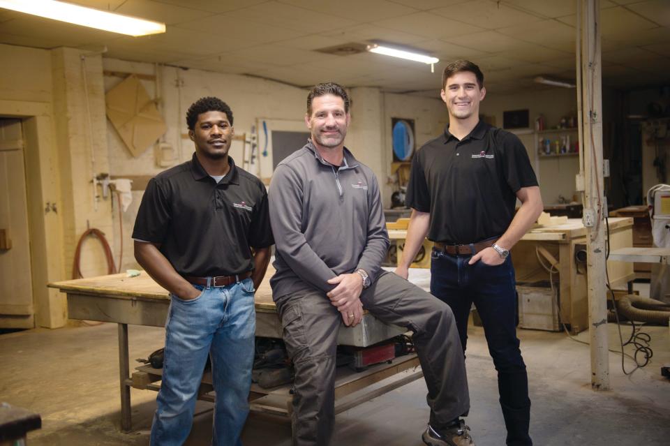 Brendan Carpenter works with longtime employee, Latra Collick, and his oldest son, Brendan Ethan Carpenter. 