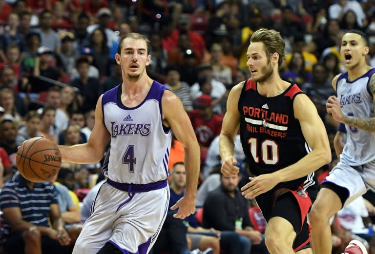 Alex Caruso of the Los Angeles Lakers drives ahead of Jake Layman of the Portland Trail Blazers during the championship game of the 2017 Summer League, at the Thomas & Mack Center in Las Vegas, Nevada, on July 17