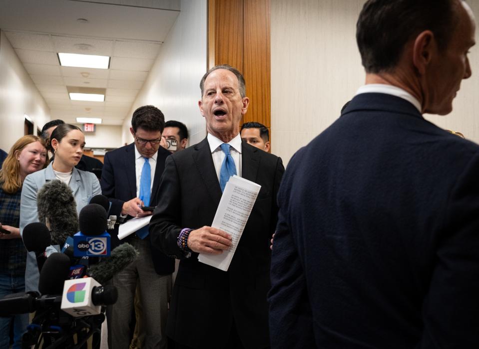 Prosecuting attorney Brian Wice, center, speaks to the press after the resolution of Texas Attorney General Ken Paxton's 9-year-old felony state securities fraud case in a special deal with prosecutors at the Harris County 248th District Court House on Tuesday, March 26, 2024 in Houston, Texas.