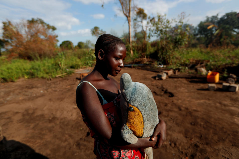 Maria Jofresse, 25, holds a stuffed toy she received for her seventh birthday as she stands where her house stood, in the aftermath of Cyclone Idai, outside the village of Cheia, which means "Flood" in Portuguese, near Beira, Mozambique April 2, 2019. (Photo: Zohra Bensemra/Reuters) 