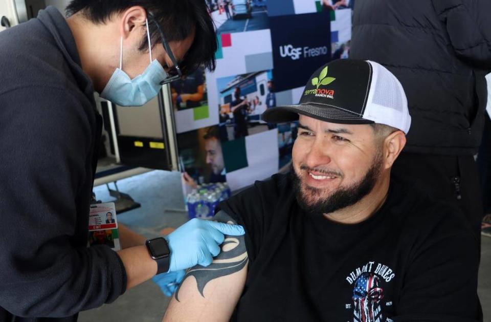 Terranova Ranch worker Gregorio Domínguez gets a flu shot administered by a volunteer during the Feb. 14, 2023 launch of the Fresno County Rural Mobile Health Program. More than 100 farmworkers participated.