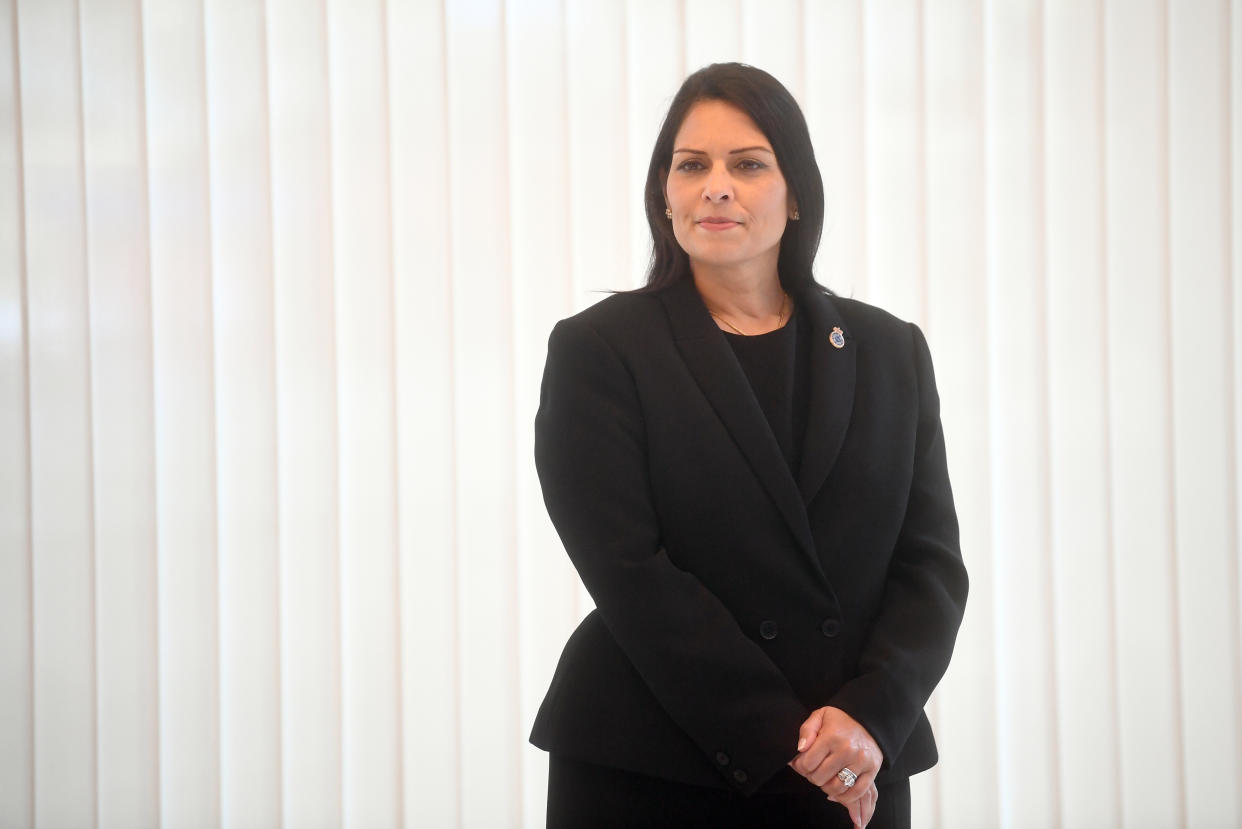 LONDON, ENGLAND - SEPTEMBER 25: Home Secretary Priti Patel observes a minute's silence inside the atrium at Scotland Yard on September 25, 2020 in London, England. A murder investigation has been launched following the death of a police officer at the Croydon Custody Centre in south London. He was shot by a 23-year-old man who was also treated for a gunshot wound. The officer died later in hospital. The death will be investigated by the  Independent Office for Police Conduct. (Photo by Victoria Jones - WPA Pool/Getty Images)