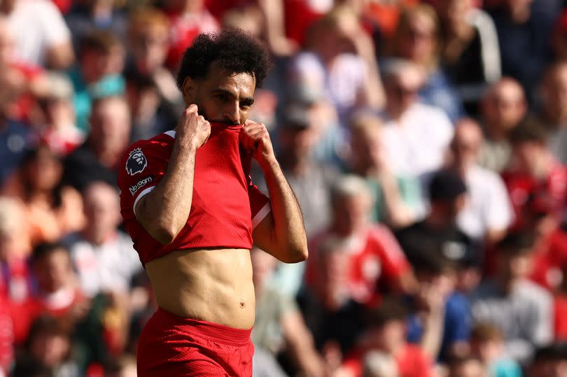 Liverpool's Egyptian striker #11 Mohamed Salah reacts during the English Premier League football match between Liverpool and Tottenham Hotspur at Anfield in Liverpool, north west England on May 5, 2024.