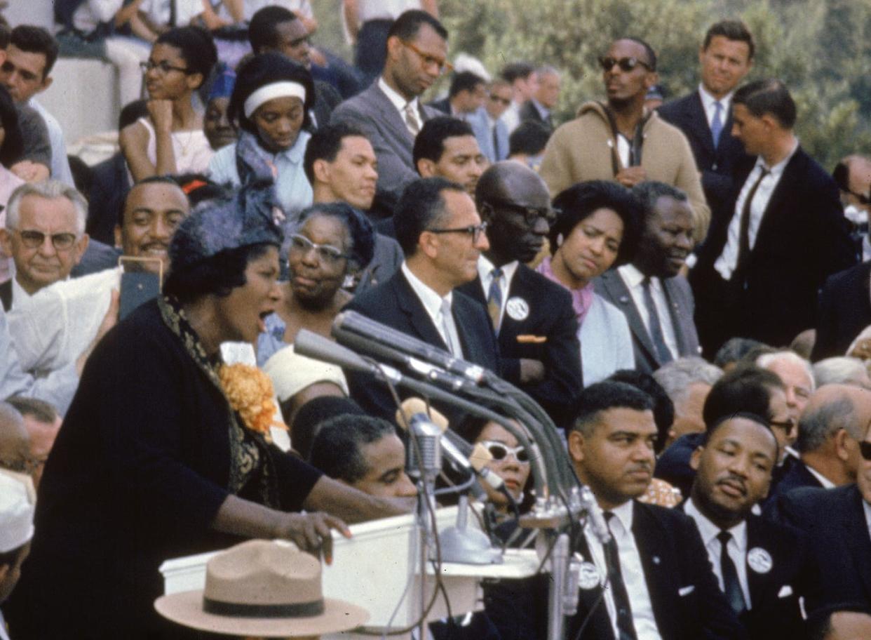 Martin Luther King Jr. (bottom right) listens to gospel singer Mahalia Jackson during the March on Washington on Aug. 28, 1963. <a href="https://www.gettyimages.com/detail/news-photo/american-singer-mahalia-jackson-sings-at-the-march-on-news-photo/53404587?adppopup=true" rel="nofollow noopener" target="_blank" data-ylk="slk:Bob Parent/Getty Images;elm:context_link;itc:0;sec:content-canvas" class="link ">Bob Parent/Getty Images</a>