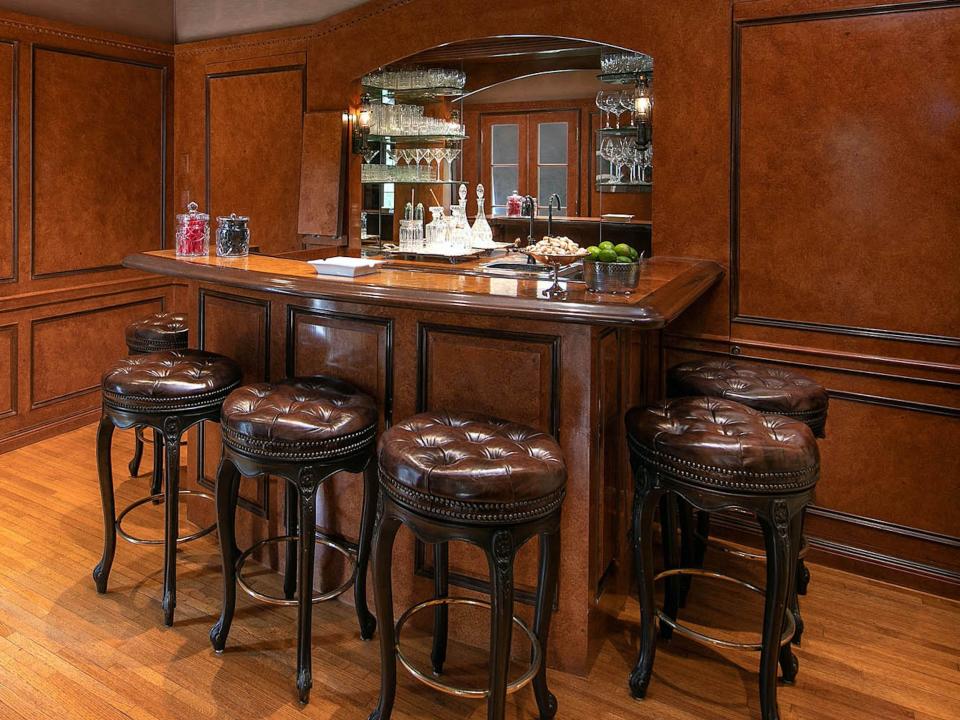 a bar with leather bar seats