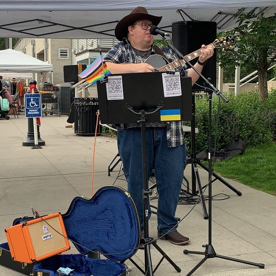 Blaine Muzyka performs mainly during the Calgary Stampede. He says his performance revenue has declined as people pay more often with debit and credit.