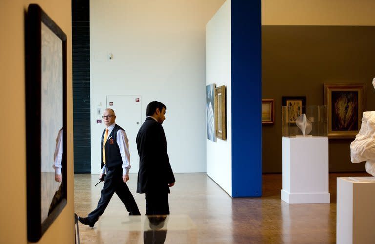 A security guard walks through the Kunsthal museum in Rotterdam, on October 17, 2012 a day after seven masterpieces were stolen in a pre-dawn heist