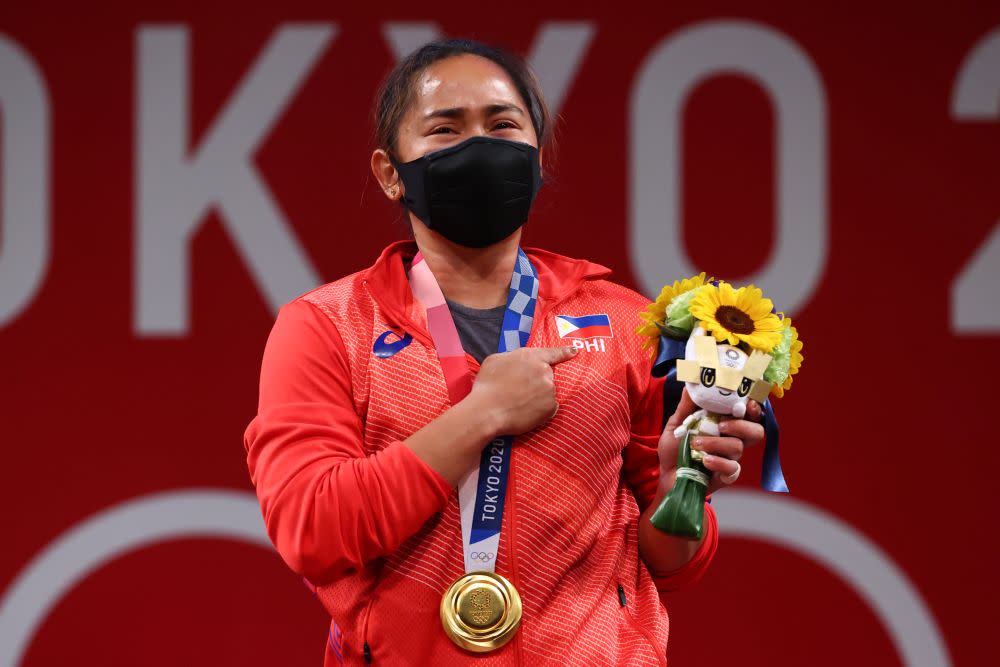 Gold medallist Hidilyn Diaz of the Philippines reacts to her victory at the Tokyo International Forum July 26, 2021. — Bernama pic