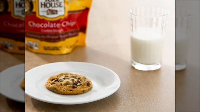 Nestle Toll House cookie on white plate with milk