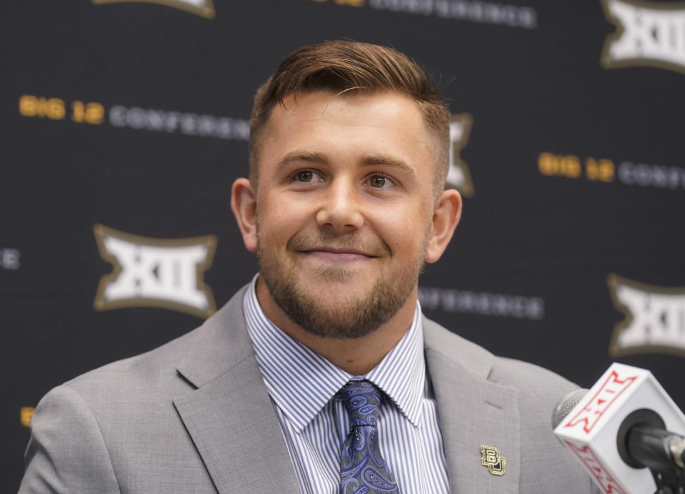 Bayor linebacker Dillon Doyle smiles while listening to a question during the NCAA college football Big 12 media days in Arlington, Texas, Wednesday, July 13, 2022. (AP Photo/LM Otero)