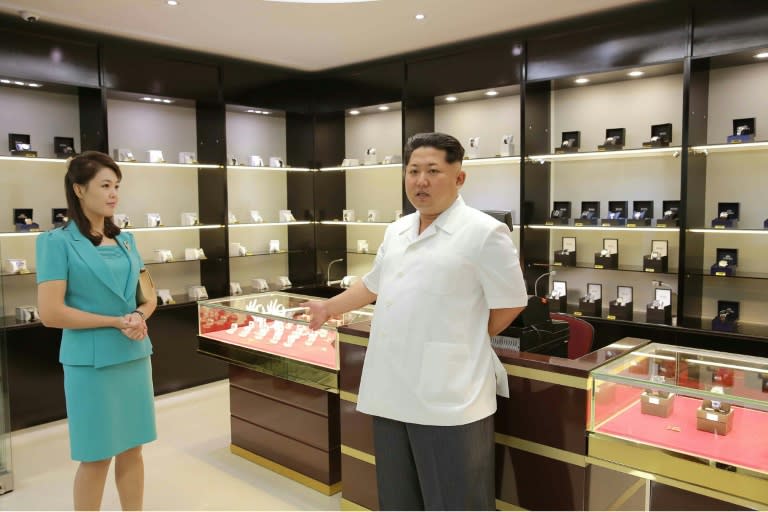 North Korean leader Kim Jong-Un, accompanied by his wife Ri Sol-Ju, inspects the new terminal at Pyongyang International Airport, on June 25, 2015