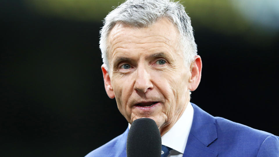 AFL commentator Bruce McAvaney is pictured broadcasting during an AFL match.