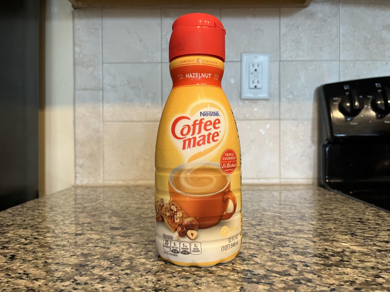 a bottle of coffee mate hazelnut coffee creamer