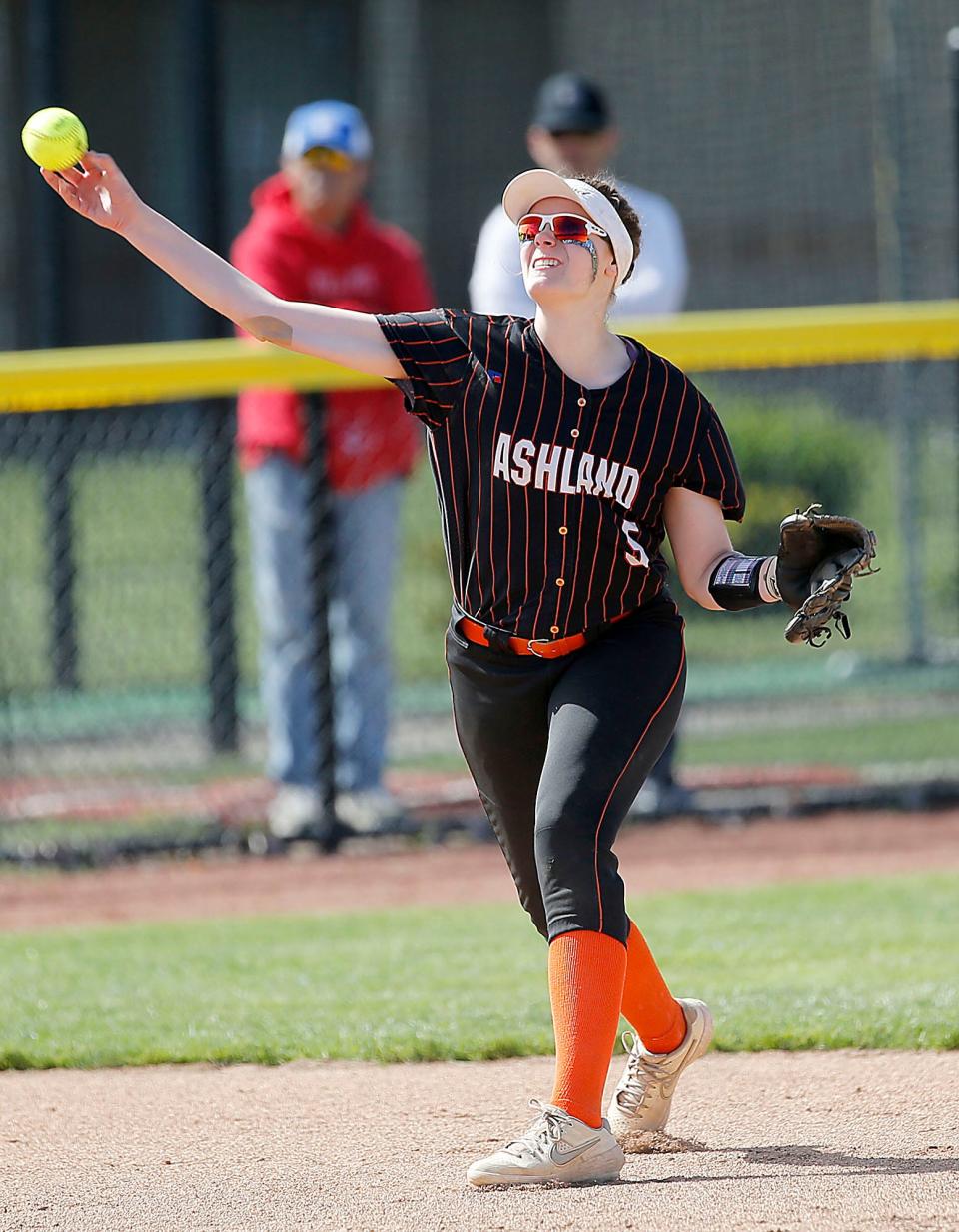 Ashland High School's shortstop Cerena Miller (5) makes a throw to first base in the second inning against Springfield High School during their OHSAA Division I semifinal game Tuesday, May 17, 2022 at University of Toledo's Scott Park. Springfield won the game 10-0. TOM E. PUSKAR/TIMES-GAZETTE.COM