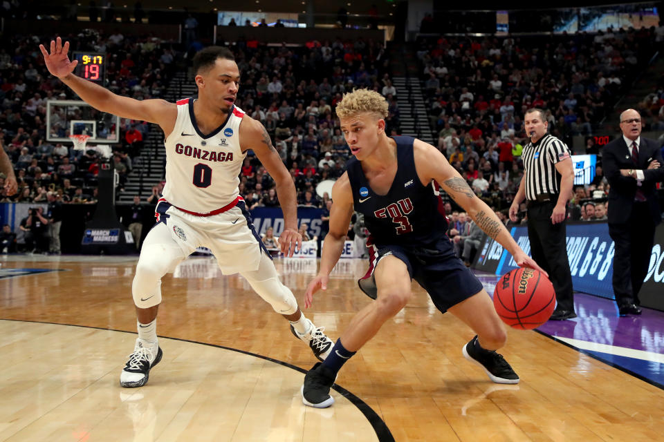 <p>Jahlil Jenkins #3 of the Fairleigh Dickinson Knights drives against Geno Crandall #0 of the Gonzaga Bulldogs during the second half in the first round of the 2019 NCAA Men’s Basketball Tournament at Vivint Smart Home Arena on March 21, 2019 in Salt Lake City, Utah. </p>