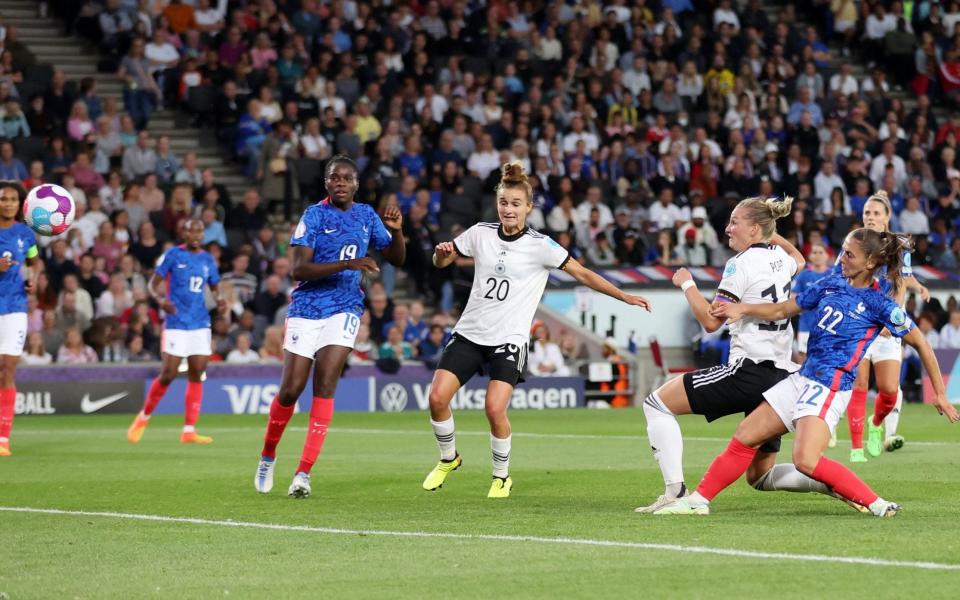 Germany's Alexandra Popp scores their first goal - Reuters