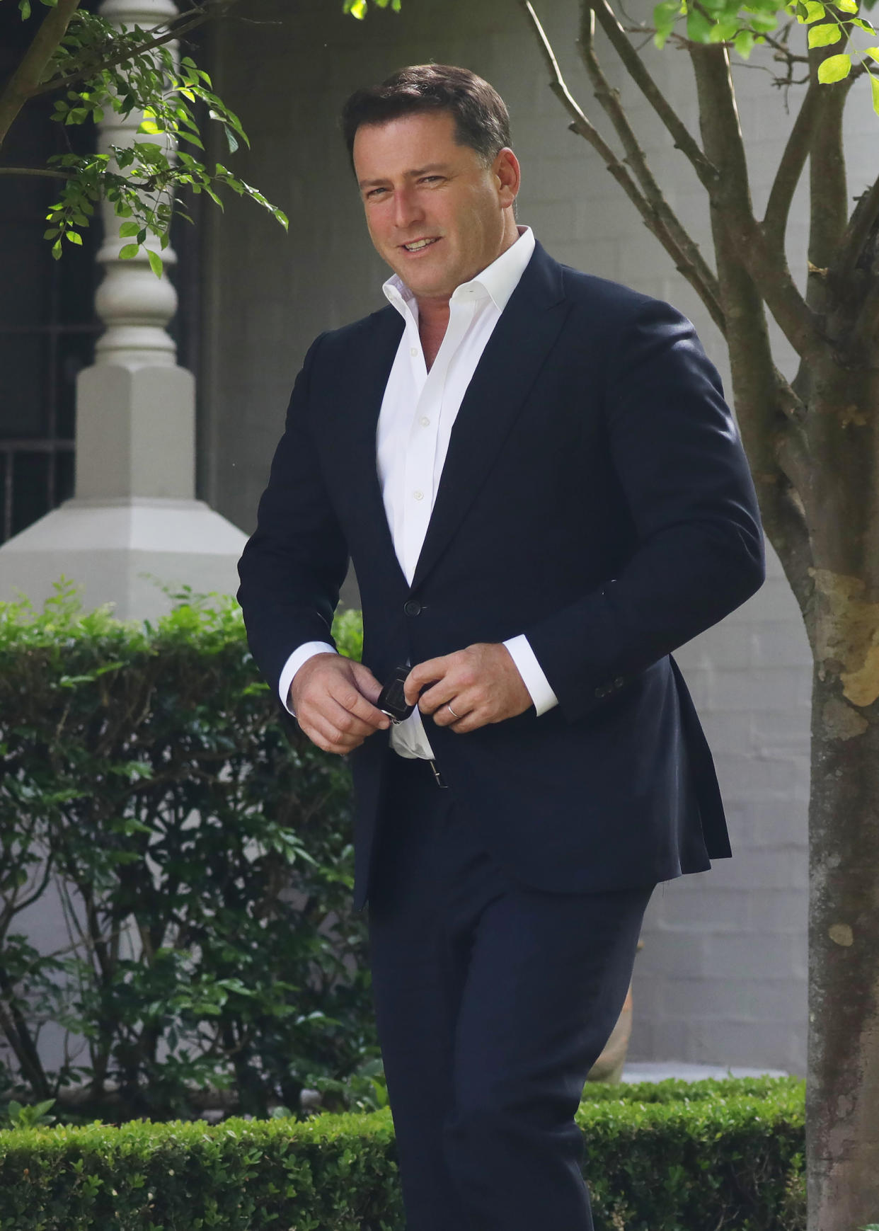 A photo of Karl Stefanovic wearing a navy suit and white shirt at the Channel Nine offices in Willoughby, Sydney.