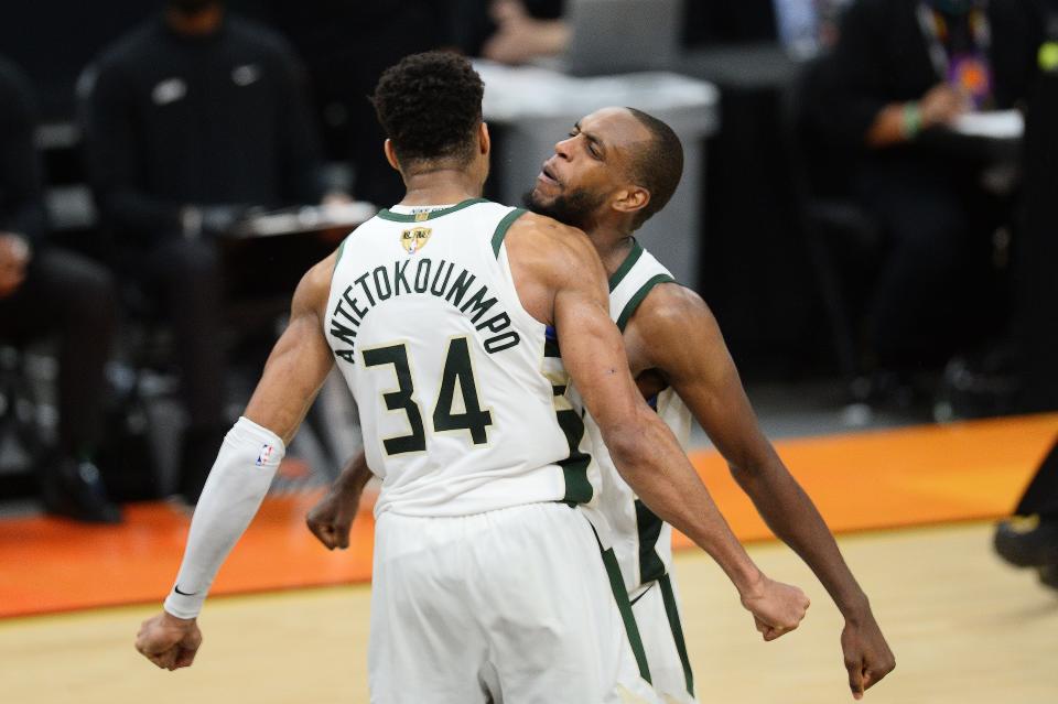 Milwaukee Bucks players Giannis Antetokounmpo and Khris Middleton celebrate after defeating the Phoenix Suns in Game 5.