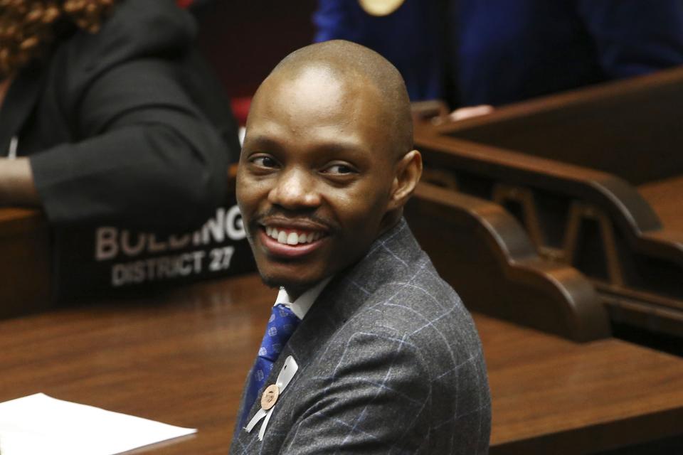 Reginald Bolding, a Democratic candidate running for Secretary of State for Arizona, sits on the floor of the Arizona House of Representatives at the Capitol Monday, Jan. 14, 2019, in Phoenix. (AP Photo/Ross D. Franklin)