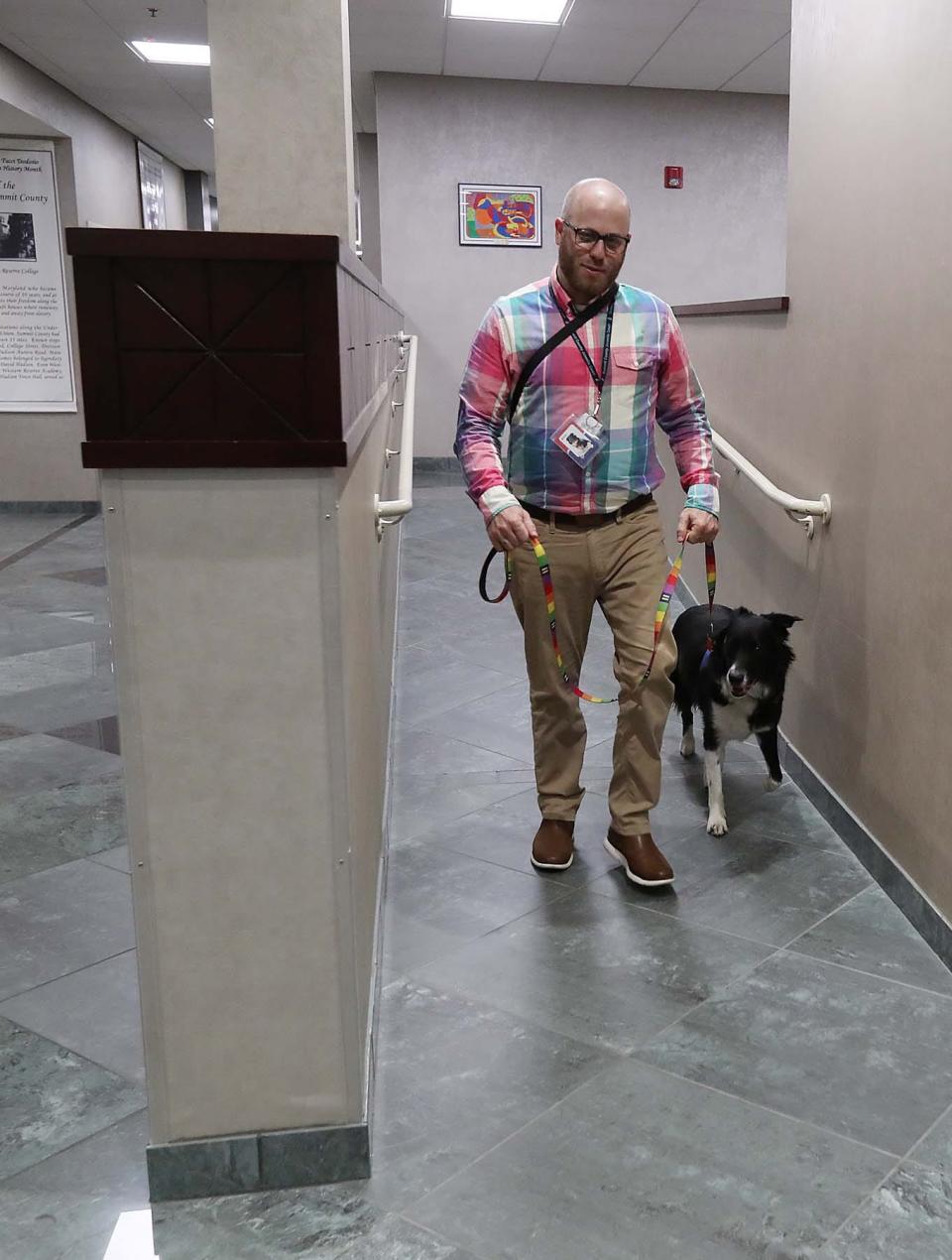 Geoff Auerbach and his dog, Tater Tot, the facility therapy dog at Summit County Juvenile Court.