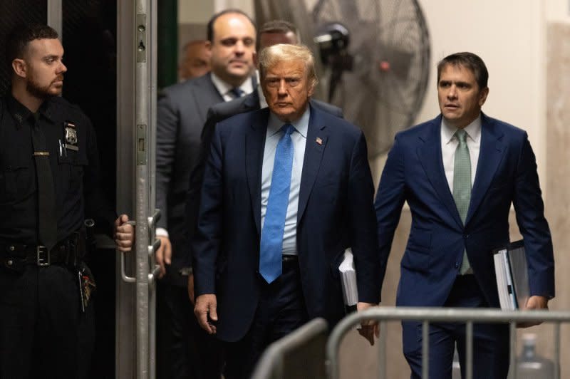 Former President Donald Trump arrives for his criminal trial at Manhattan Criminal Court in New York on Friday. Trump is facing charges he allegedly falsified business records to cover up a sex scandal during the 2016 presidential campaign. Pool photo by Jeenah Moon/UPI