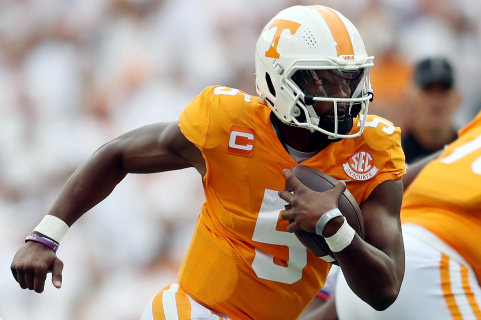 KNOXVILLE, TENNESSEE - SEPTEMBER 24: Hendon Hooker #5 of the Tennessee Volunteers runs with the ball against the Florida Gators in a college football game at Neyland Stadium on September 24, 2022 in Knoxville, Tennessee. Tennessee won the game 38-33. (Photo by Donald Page/Getty Images)