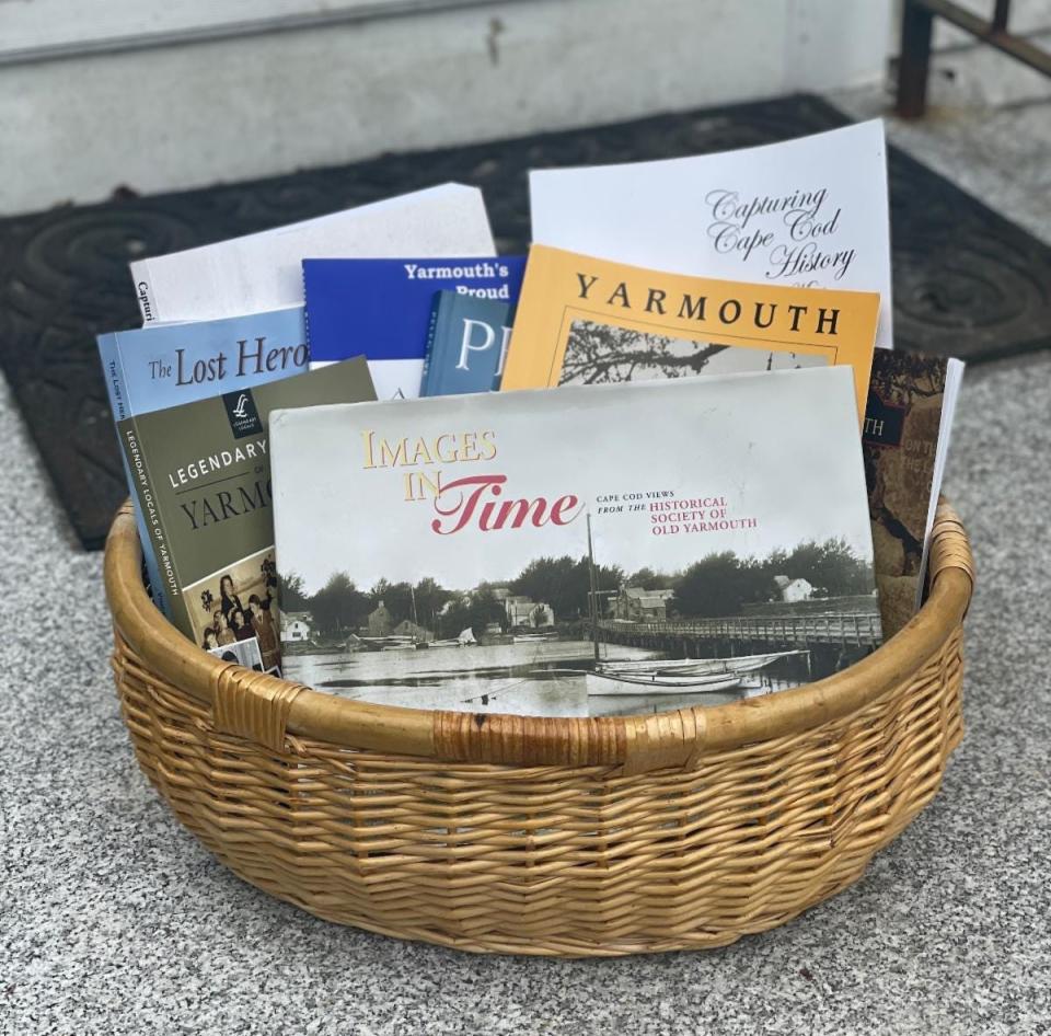 A basket of books about local history from the Historical Society of Old Yarmouth gift shop.