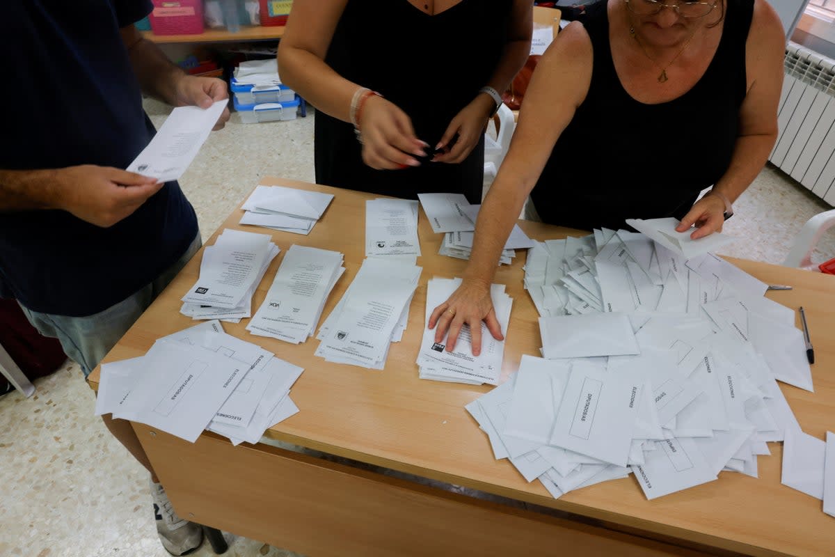 Election workers count ballots at a polling station during the general snap election, in Ronda (REUTERS)