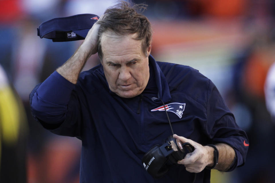 New England Patriots head coach Bill Belichick rubs his head in the closing minutes of the second half of the AFC Championship NFL playoff football game in Denver, Sunday, Jan. 19, 2014. The Broncos defeated the Patriots 26-16 to advance to the Super Bowl. (AP Photo/Joe Mahoney)