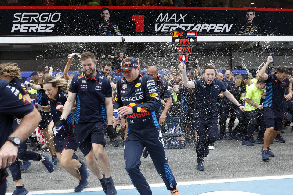 Red Bull driver Max Verstappen of the Netherlands celebrates with team members after winning the Formula 1 Spanish Grand Prix race at the Barcelona Catalunya racetrack in Montmelo, near Barcelona, Spain, Sunday, June 23, 2024. (AP Photo/Joan Monfort)