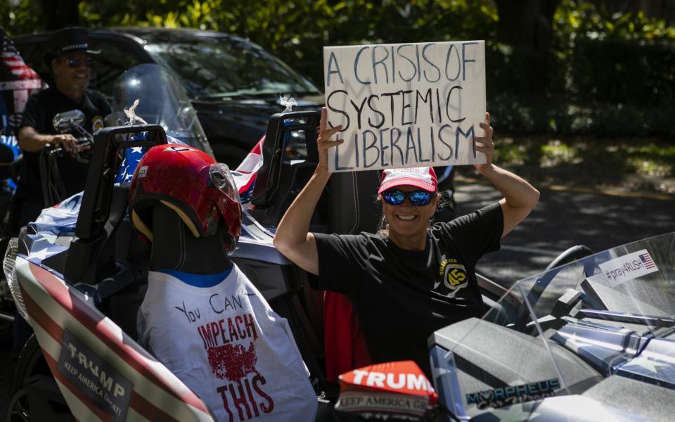 Trump supporters outside the conference in Orlando - GETTY IMAGES