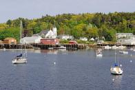 <p>Located on the coast of the North Atlantic, Boothbay Harbor is a small harbor town that probably features more boats than cars. With a population of about 3,130, this is seriously tiny, but in the best way. The very walkable village is packed with restaurants that serve the most incredible seafood, and there are hiking trails near by. Don't miss an <a href="https://www.cabbageislandclambake.com/" rel="nofollow noopener" target="_blank" data-ylk="slk:authentic New England clambake;elm:context_link;itc:0;sec:content-canvas" class="link ">authentic New England clambake</a> that takes place a ferry ride away on Cabbage Island.</p>