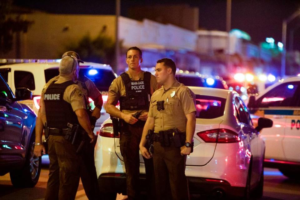 Miami-Dade Police work a crime scene around Northwest 62nd Street and Seventh Avenue in Miami, Florida on Monday, June 15, 2022. A Miami-Dade police officer was shot after a car chase in Liberty City on Monday night, multiple law enforcement sources said.