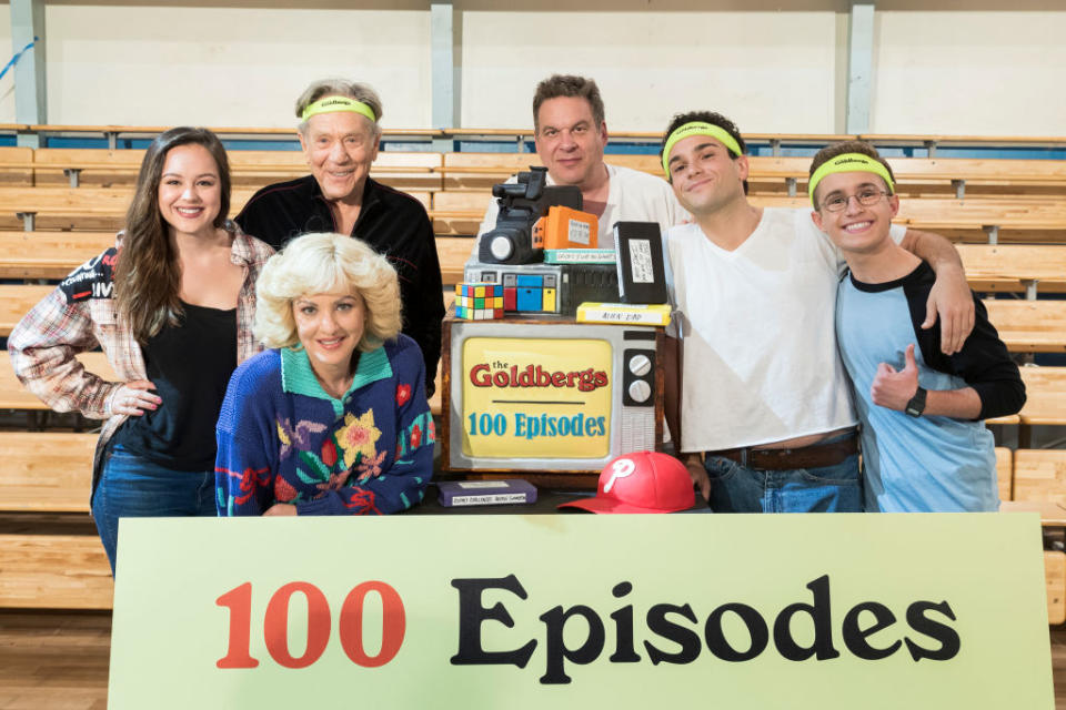 <em>The Goldbergs</em> cast, including Hayley Orrantia, George Segal, <span class="caas-xray-inline-tooltip"><span class="caas-xray-inline caas-xray-entity caas-xray-pill rapid-nonanchor-lt" data-entity-id="Jeff_Garlin" data-ylk="cid:Jeff_Garlin;pos:6;elmt:wiki;sec:pill-inline-entity;elm:pill-inline-text;itc:1;cat:Actor;" tabindex="0" aria-haspopup="dialog"><a href="https://search.yahoo.com/search?p=Jeff%20Garlin" data-i13n="cid:Jeff_Garlin;pos:6;elmt:wiki;sec:pill-inline-entity;elm:pill-inline-text;itc:1;cat:Actor;" tabindex="-1" data-ylk="slk:Jeff Garlin;cid:Jeff_Garlin;pos:6;elmt:wiki;sec:pill-inline-entity;elm:pill-inline-text;itc:1;cat:Actor;" class="link ">Jeff Garlin</a></span></span>, Troy Gentile, Sean Giambrone and Wendi McLendon-Covey celebrate the show's 100th episode in 2017. (Photo: Rich Polk/Getty Images for Sony Pictures Television)