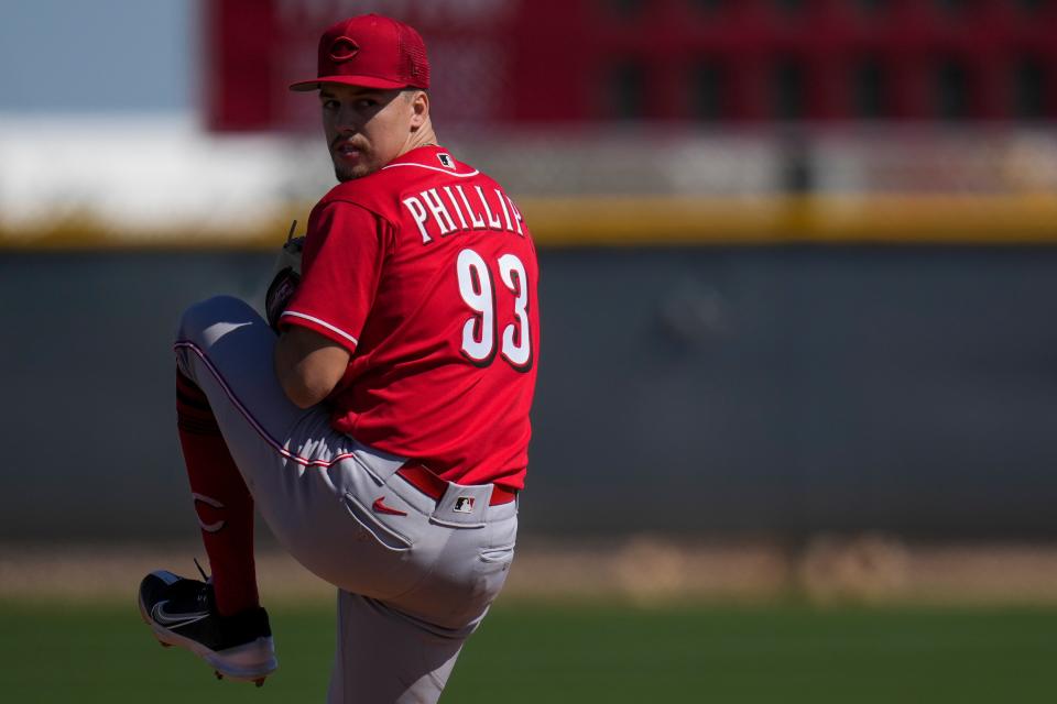 Cincinnati Reds pitcher Connor Phillips winds up to deliver a pitch during live batting practice. Phillips and prospects Andrew Abbott both made strong impressions during their stints in big league camp.