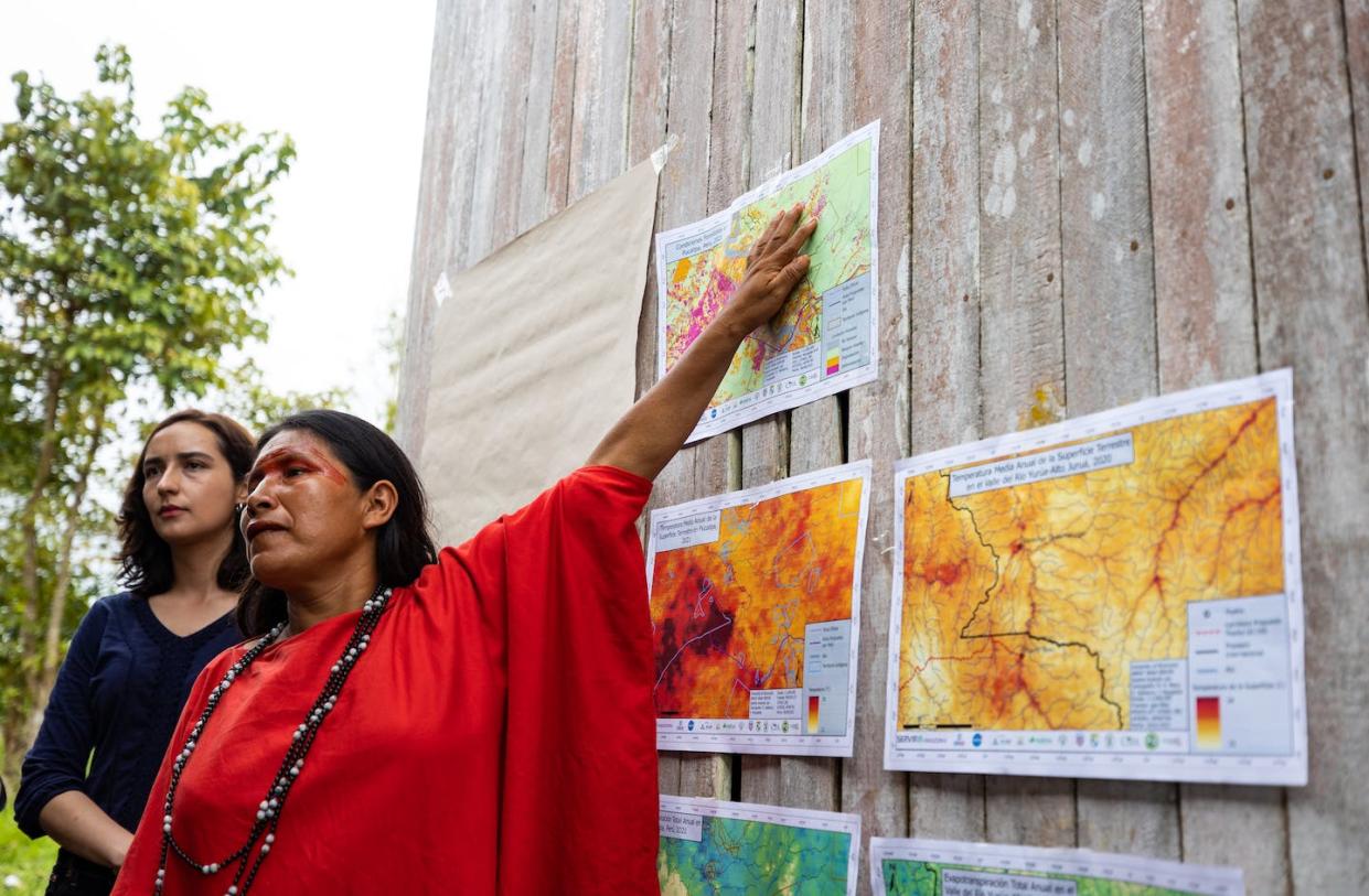 Maria Elena Paredes, coordinator of the Community Vigilance Committee for the Ashéninka community of Sawawo Hito 40, points to satellite images showing deforestation. <a href="https://earthobservatory.nasa.gov/blogs/fromthefield/2022/09/07/indigenous-experience-shaping-nasa-services-in-the-amazon/" rel="nofollow noopener" target="_blank" data-ylk="slk:Reynaldo Vela/USAID;elm:context_link;itc:0;sec:content-canvas" class="link ">Reynaldo Vela/USAID</a>