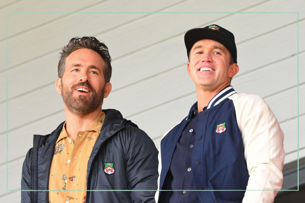  How did Ryan Reynolds and Rob McElhenney meet, as illustrated by a picture of them smiling during the Vanarama National League match between Wrexham and Notts County 